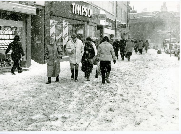 Photograph showing pedestrians as they brave the arctic conditions in Dundee City Centre. 12 January 1987.