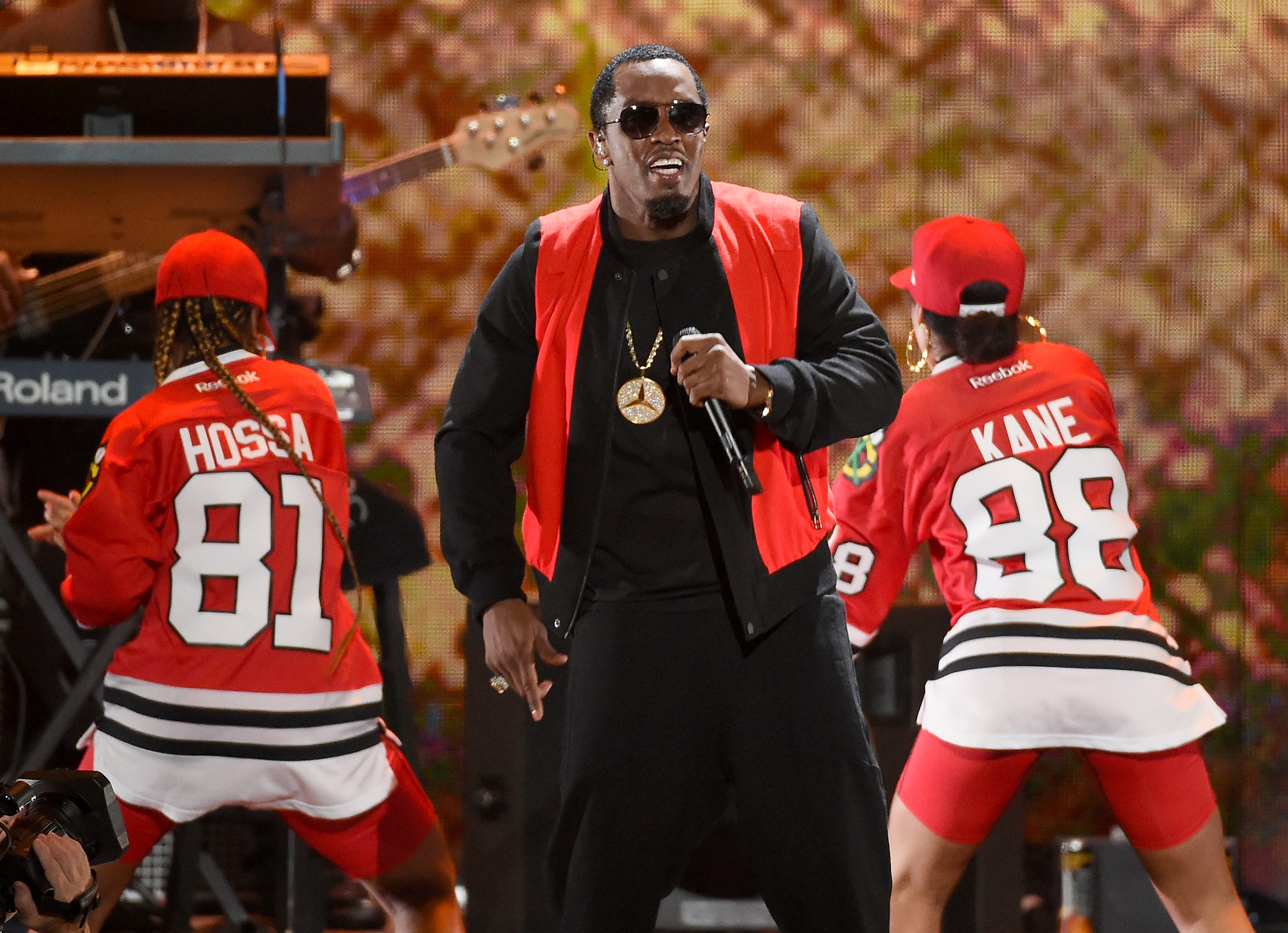 Recording artist Sean "Diddy" Combs performs with dancers.