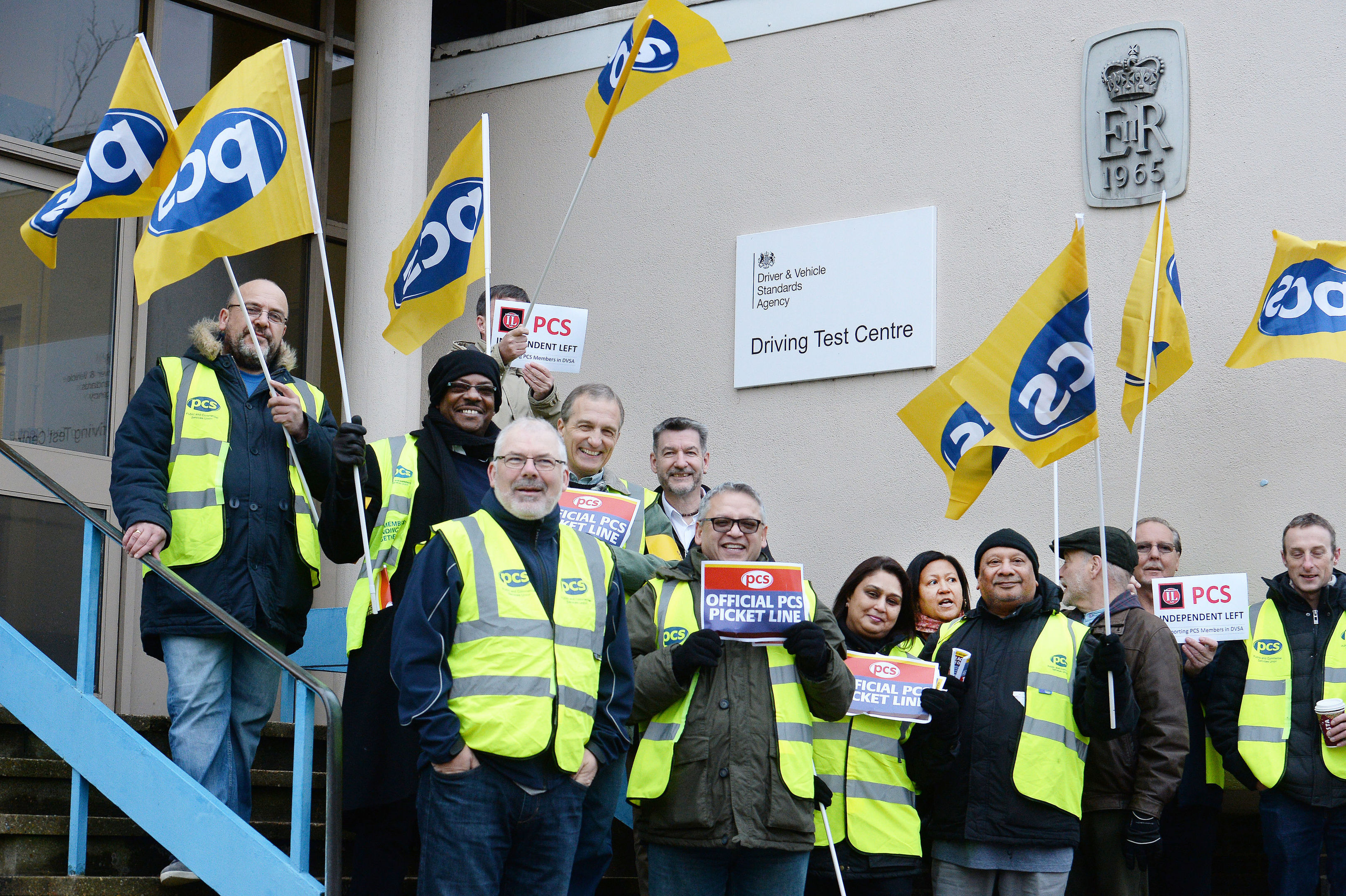 A group of driving examiners on a picket line outside the driving test centre in Barnet, north London yesterday