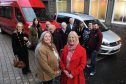 Staff, volunteers and members of the Inclusion Group with the new vehicles donated by Gillian Bayford. Centre L-R Gillan Bayford and Inclusion Group manager Fiona Flynn.