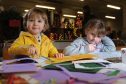 David Ibbotson (3 1/2) and Joan Lily Scappaticcio (6 1/2) enjoy some craft activities at the market,