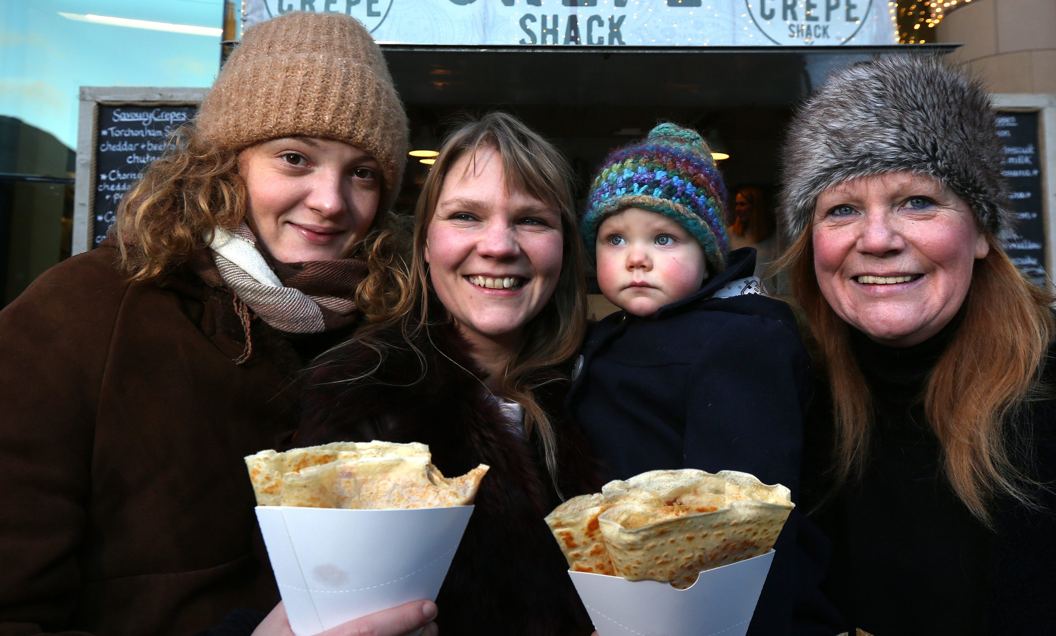 Stephanie Fraser and Claire, Inca and June Pickett enjoying festive crepes.