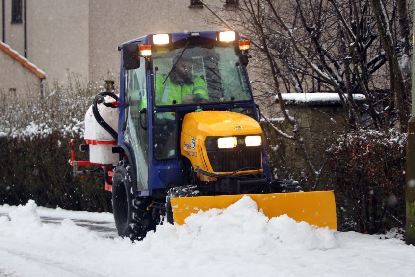 A snowplough keeping the pavements around Milnathort clear.
