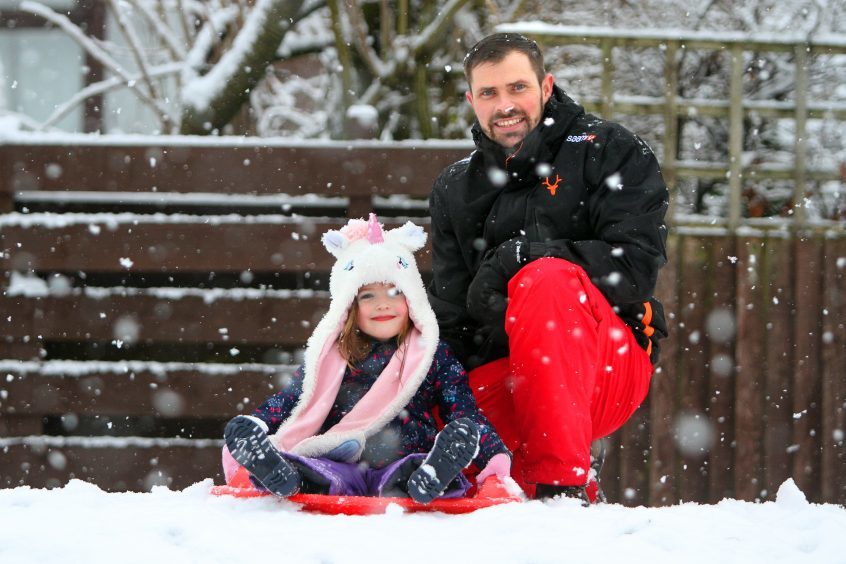 Guy and Faye Little sledging.