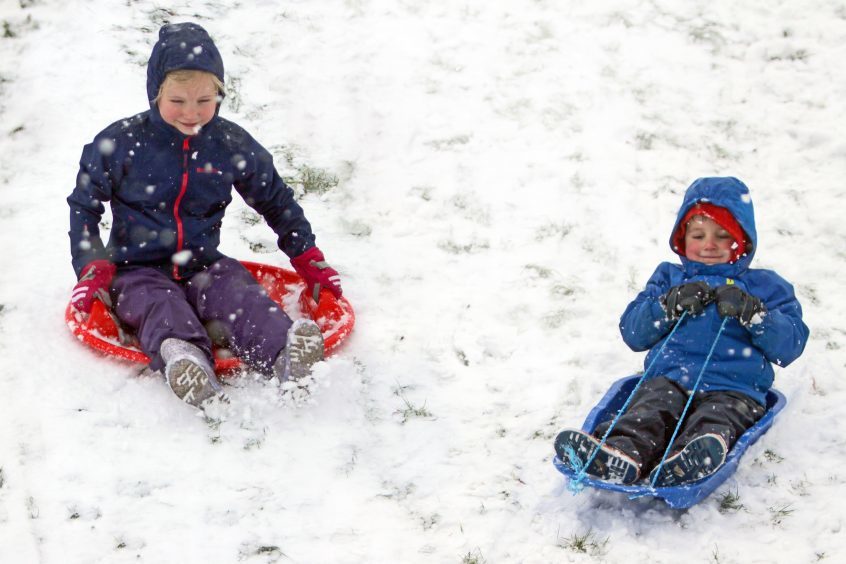 Lily and Jacob Halliday sledging in Kinross.