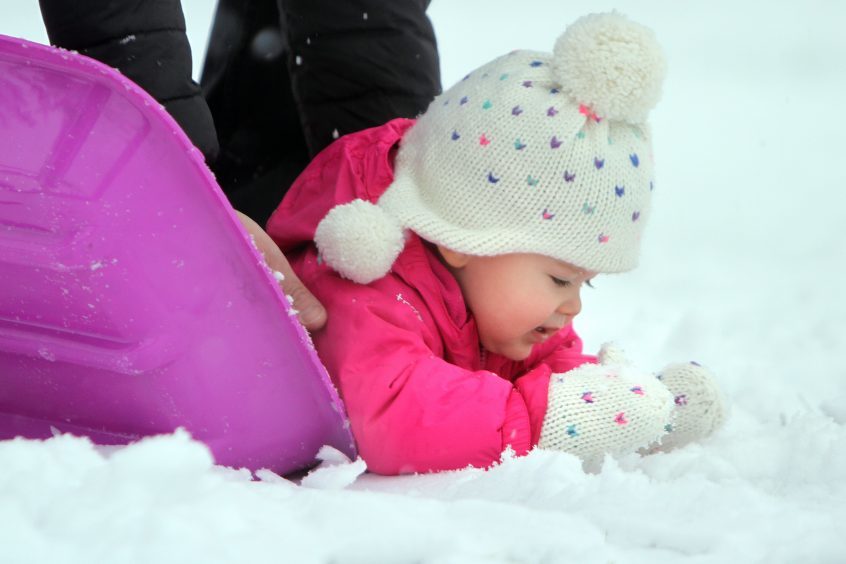 18-month-old Hannah Bradford who was experiencing snow for the first time in Kinross.
