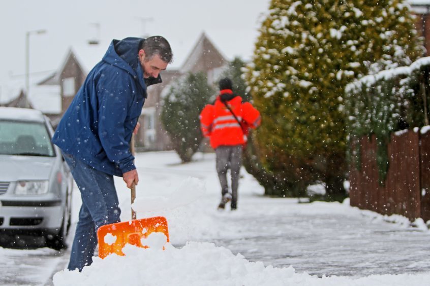 Residents clearing the streets in Kinross