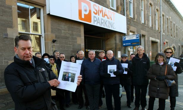 Murdo Fraser MSP with some of those penalised by Smart Parking launching his Holyrood members bill on private parking firms, outside the car park on Kinnoull Street in Perth.