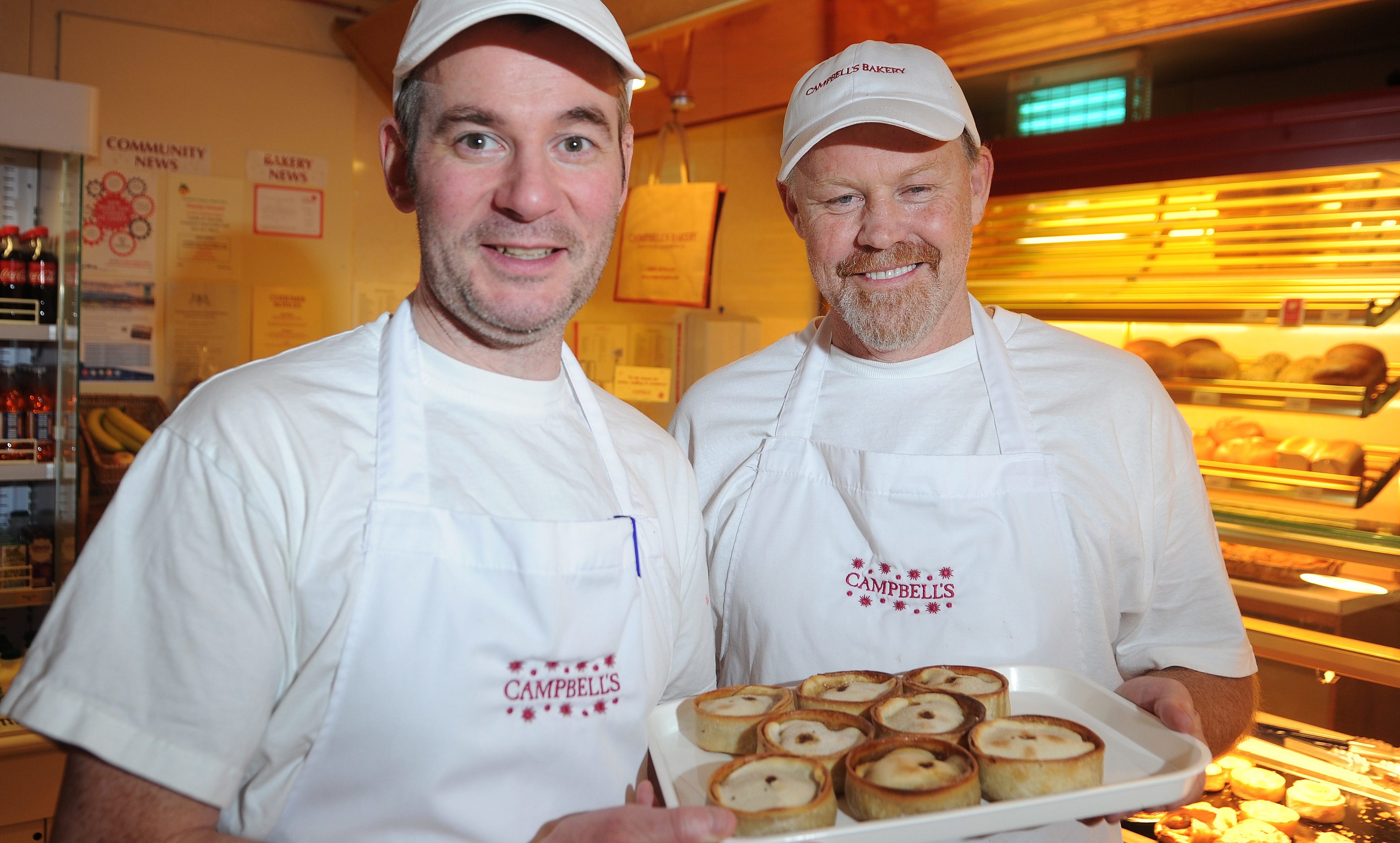 Iain Campbell and Bruce Hall with some of the scotch pies that he has learnt to make ath the King Street bakery, Crieff