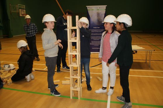 Children from St Peter and Paul's Primary School taking part in the infrastructure project (tower building) during Fife Science Festival at Craigowl PS
