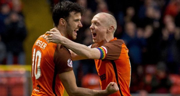 Scott Fraser is congratulated by Willo Flood after opening the scoring.