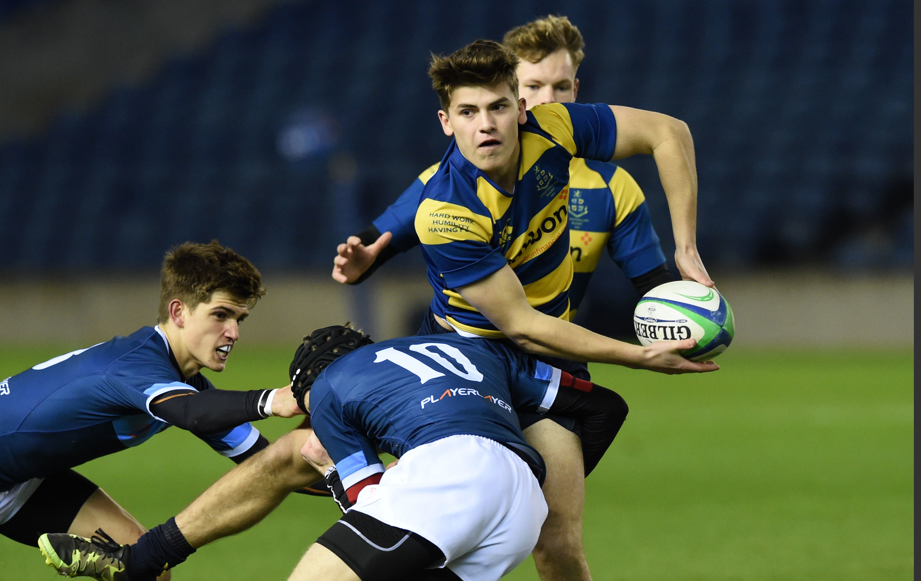 Man of the Match Angus Vipond of Strathallan is tackled by Glenalmond's Rafe Houston at Murrayfield.