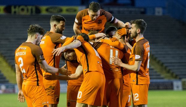 United players celebrate with goalscorer Billy King.