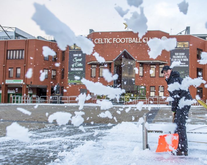 Snow is cleared of the surrounding area of Celtic Park