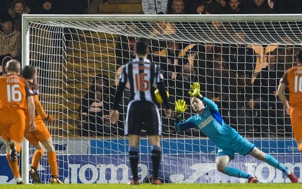 Craig Samson saves the Paul McMullan penalty.