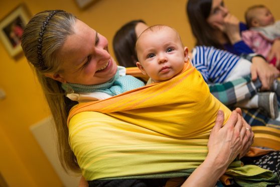 Mum Maren Dralle and baby Hanne-Lotte attend a Dundee Sling Library meeting.