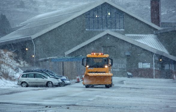 Storm Caroline: A snowplough in a blizzard in the Cairngorm National park as winds hit 120mph.