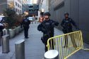Police block off a sidewalk while responding to a report of an explosion near Times Square.