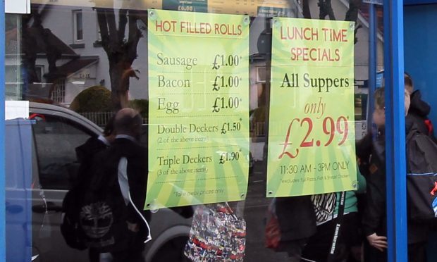 Pupils flocking to buy lunchtime specials at a takeaway near their school.