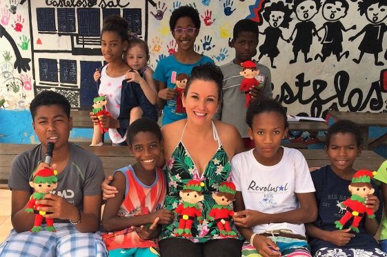 Elaine Harris on Cape Verde, with children from the Castelos do Sal charity and their Make An Elf arts kits.