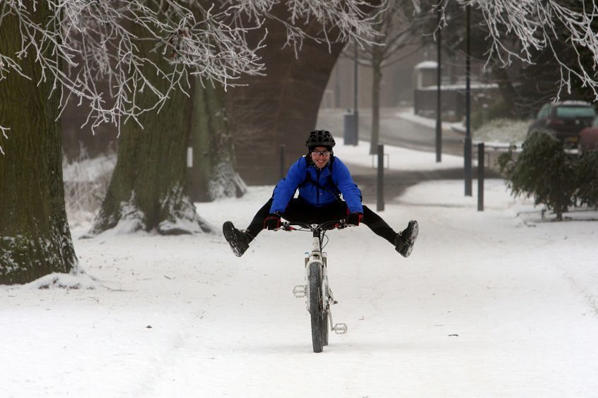 A cyclist in North Inch during snow, December 2009.