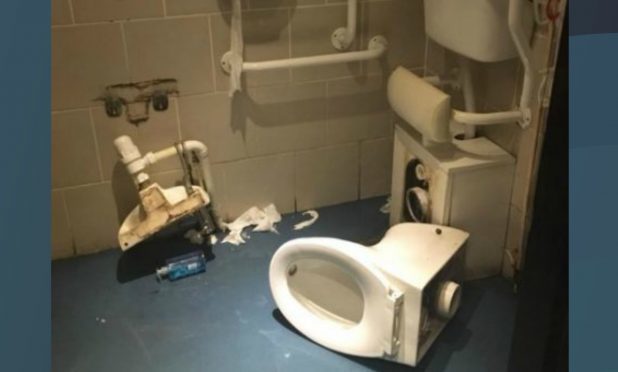 The collapsed toilet.