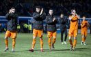 The Dundee United players on the pitch after the match is abandoned.