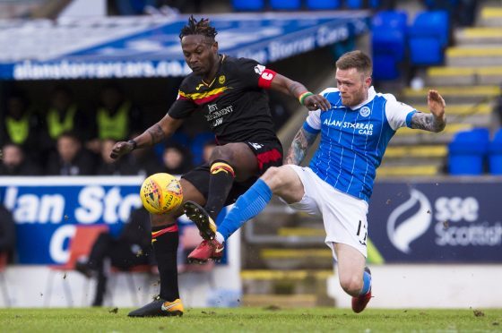 Abdul Osman and Denny Johnstone battle for possession.