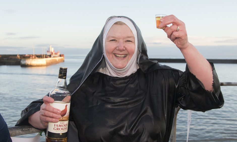 Sandra Michie from Carnoustie enjoys a warming dram after her swim