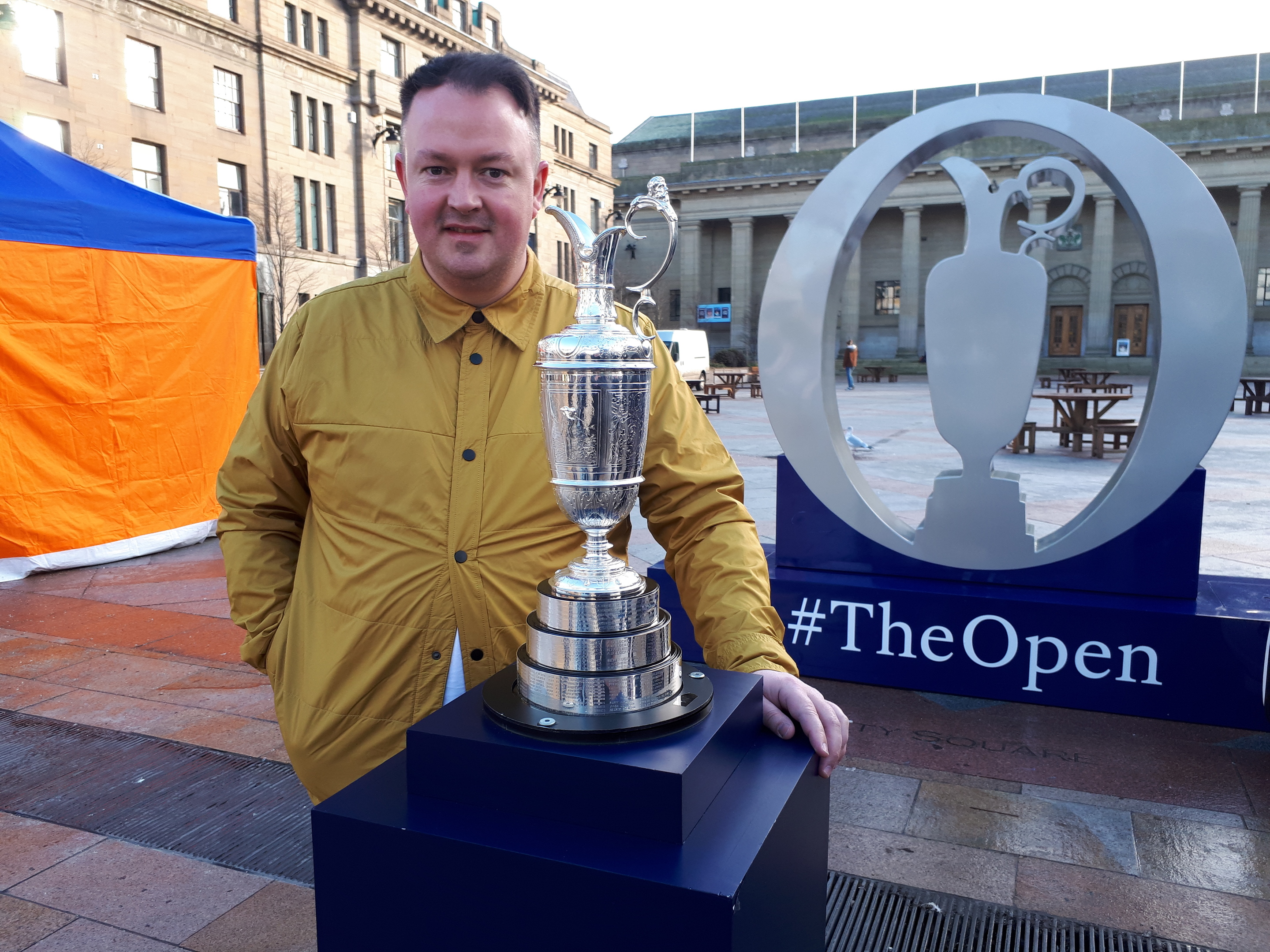 Stephen Rollo posing with the Claret Jug.