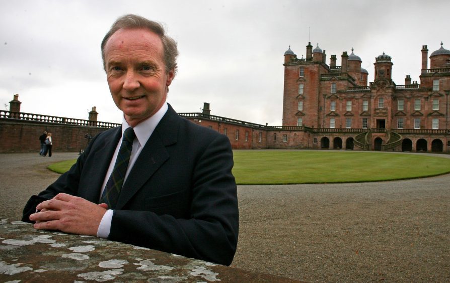 The Duke of Buccleuch stands in front of Drumlanrig Castle