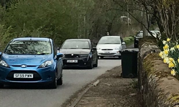 Convoy of traffic on Moneydie road.