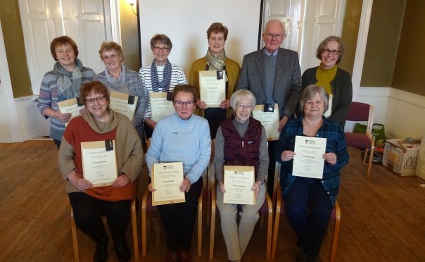 Some of the volunteers at Falkland Palace with their certificates.