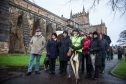 Guide Elaine Campbell pauses at Dunfermline Abbey as she leads a historical guided walk in Dunfermline