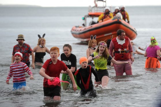 Some of the intrepid bather at  Kinghorn Beach during the traditional New Year Dook.