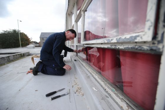 Repairing damage caused by vandals at St Luke's and St Matthew's RC Primary School in 2016.