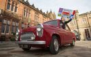 Emilia Kozlowska, 10, who won a competition to design the event start flag, pictured in the Ford Prefect of  Angus crew David Tindal, Alan Falconer and Stephen Woods