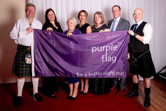 Dunfermline Delivers celebrate the purple flag award.