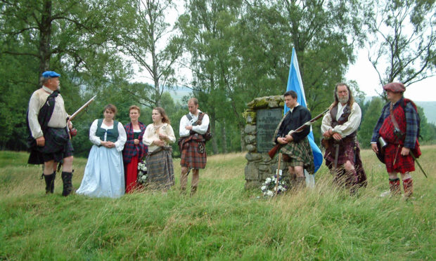 Rulzion Rattray, extreme left and James Rattray extreme right with members of the White Cockade Society at Battle of Killiecrankie Memorial Cairn