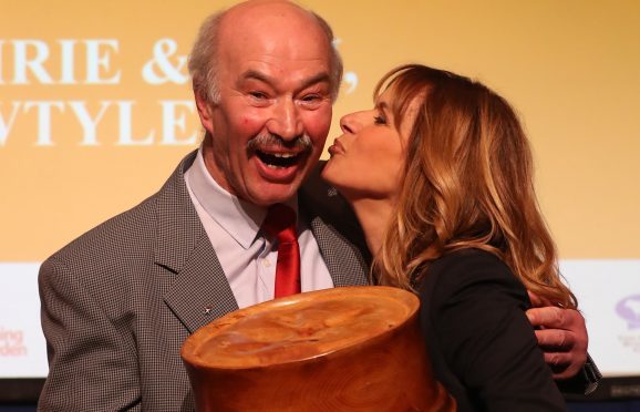 Alan Pirie is congratulated by host Carol Smillie after winning the World Champion Scotch Pie award