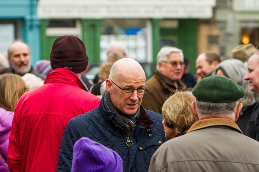 John Swinney in crowd of people at Aberfeldy