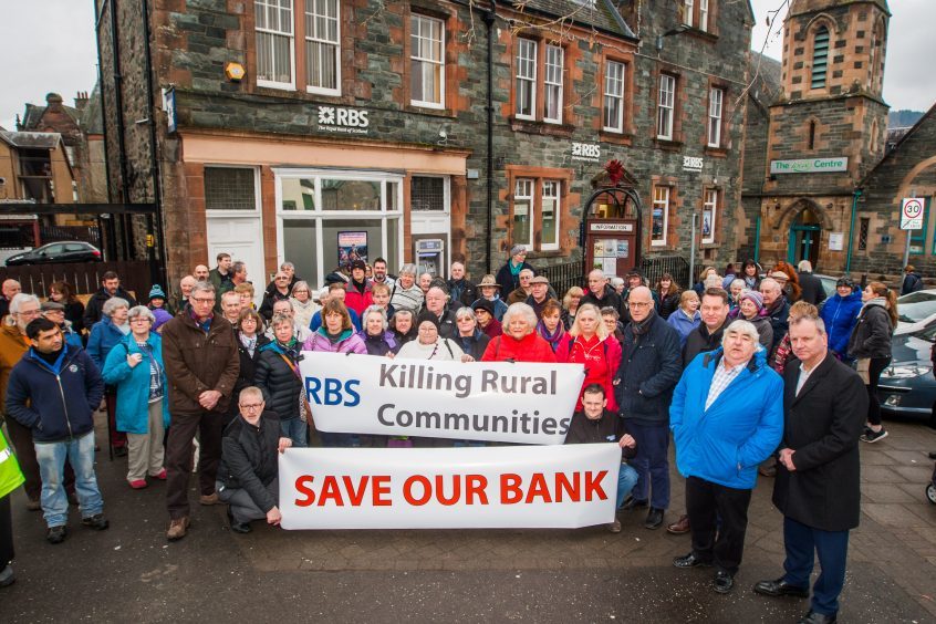 Protestors call for Aberfeldy's Royal Bank of Scotland to stay open.