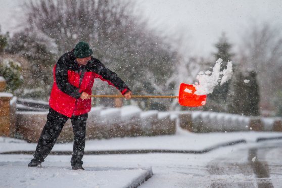 Ronnie Rogalski clears paths on Castleton Road, Auchterarder, earlier this week.