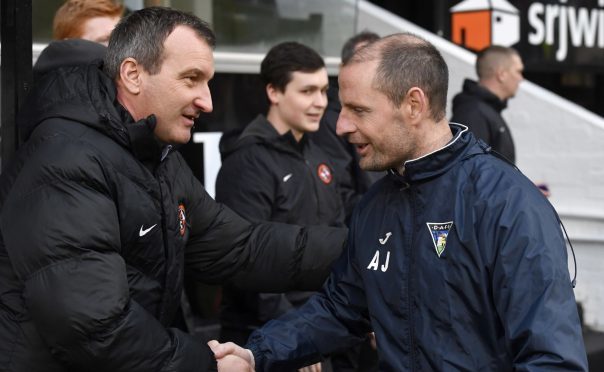 Csaba Laszlo and Allan Johnston shake hands.