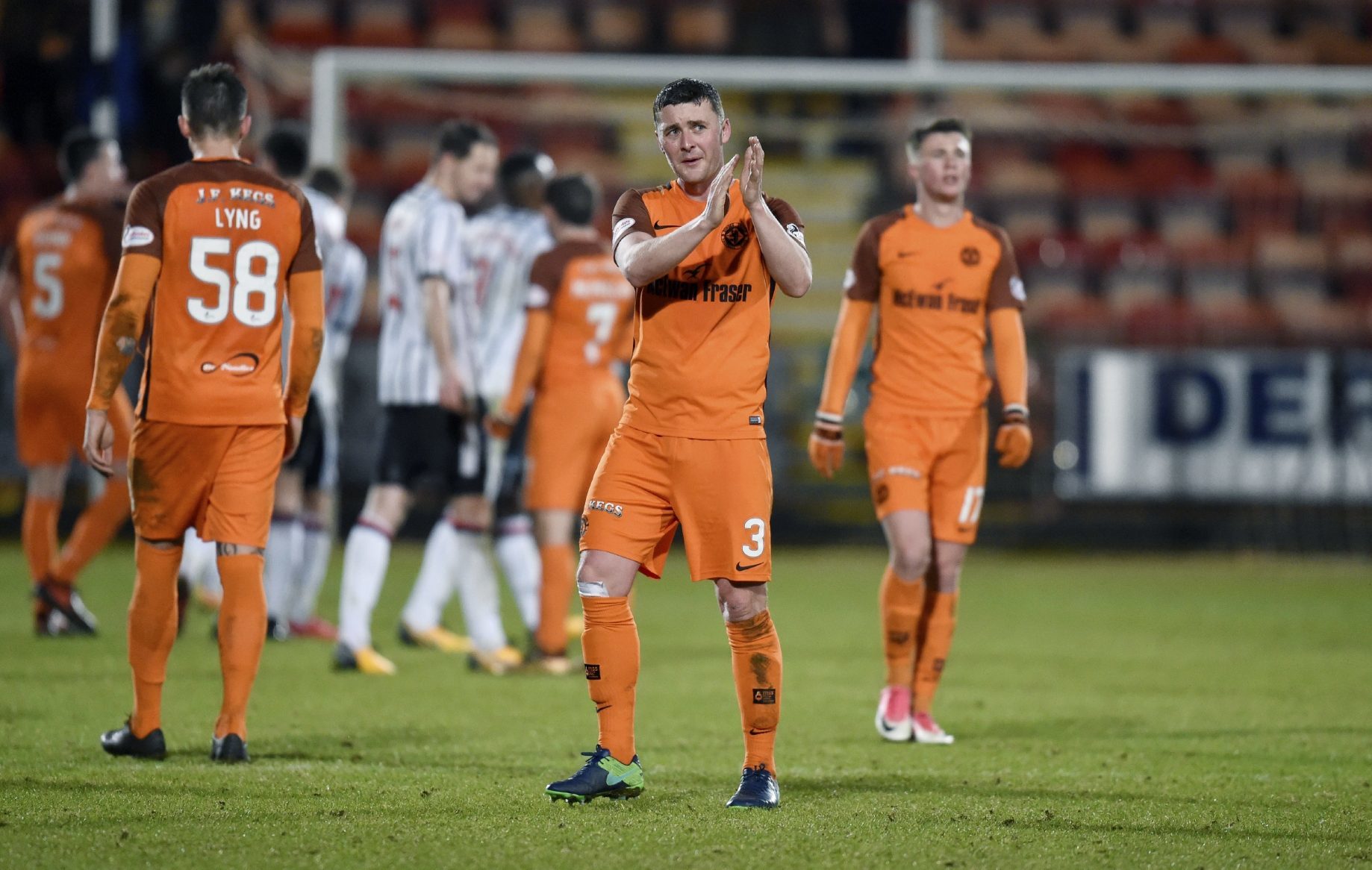 Tam Scobbie applauds the United fans after the draw at Dunfermline.