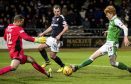 Elliot Parish saves from Hibs striker Simon Murray.