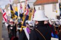 Dignitries and Armed Forces attend memorial service on the shore in Anstruther