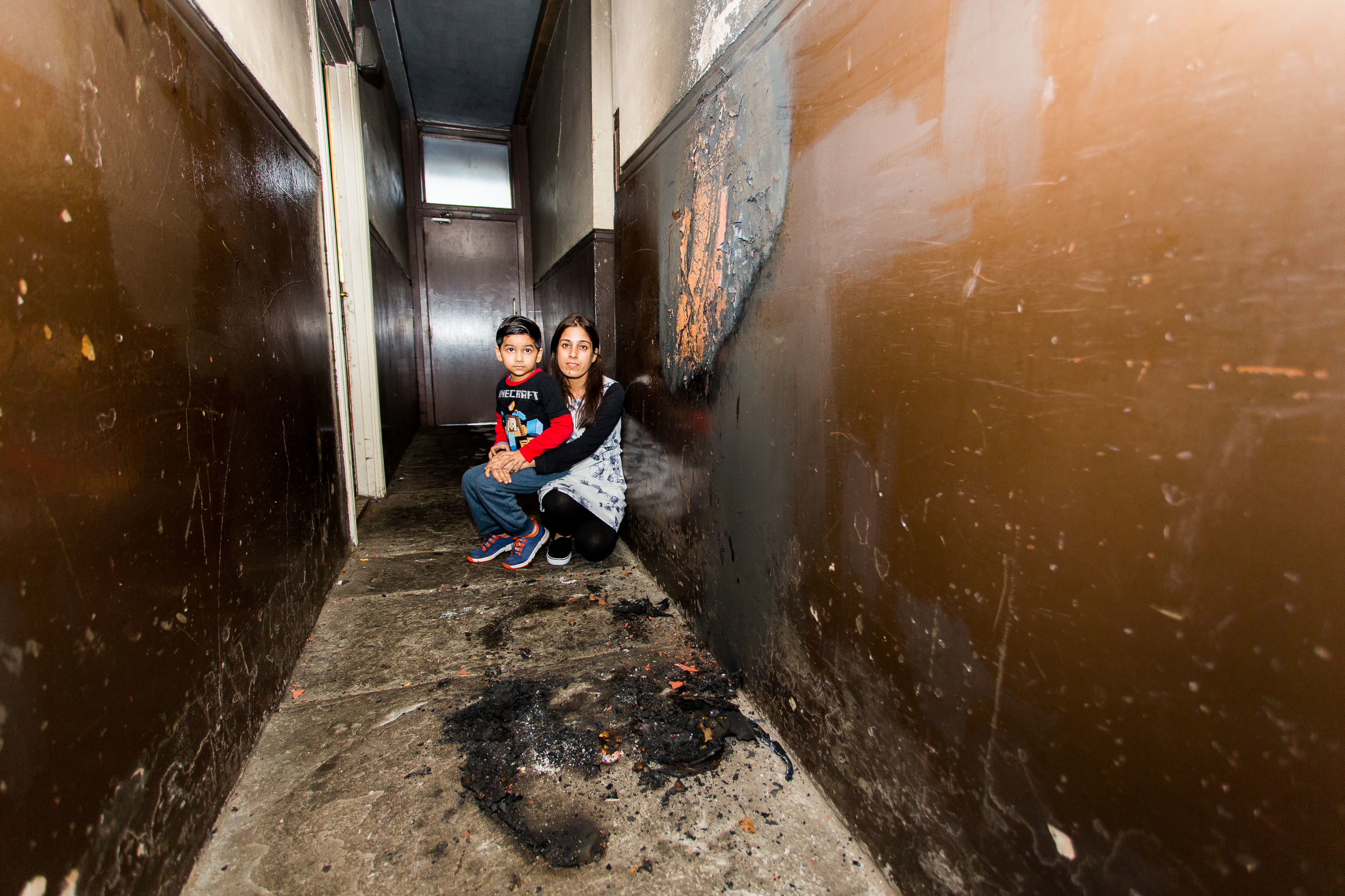 Five-year-old Dimanshu Kafle with mother Menuka Kafle where the buggy was set alight.