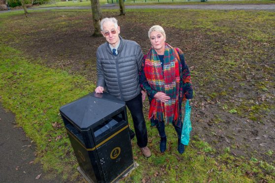 Community Council secretary David Taylor with councillor Rosemary Liewald at one of the newly installed multi-use bins in the park.