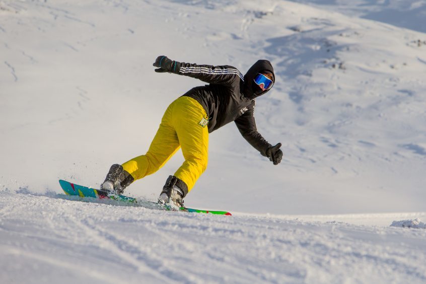 A snowboarder on the slopes